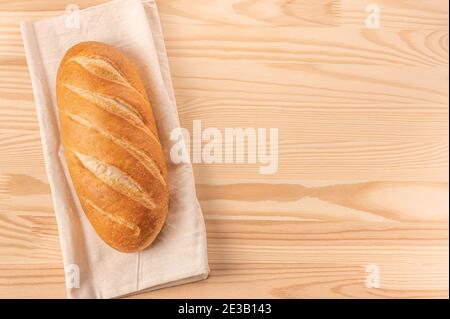 Bread. fresh bread on light wooden table. Whole bread. Template homemade bread recipe. copy space. top view Stock Photo
