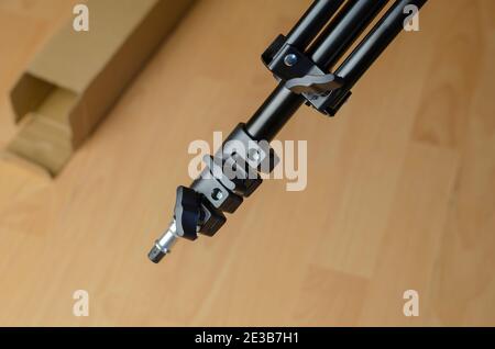 Continuous light photographic equipment, softbox. The top of the black softbox tripod. Stock Photo