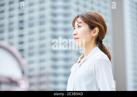 Young Japanese businesswoman in the hot Summer downtown Tokyo Stock Photo -  Alamy