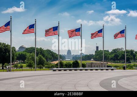 American flags at sunny day and Capitol Building in background in Washington DC, USA. Stock Photo