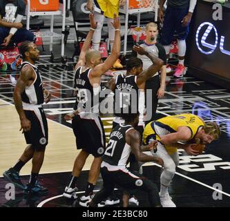 Los Angeles, United States. 18th Jan, 2021. Indiana Pacers' forward Domantas Sabonis secures the offensive rebound surrounded by Los Angeles Clippers' defenders during the fourth quarter at Staples Center in Los Angeles on Sunday, January 17, 2021. The Clippers defeated the short-handed Pacers 129-96. Photo by Jim Ruymen/UPI Credit: UPI/Alamy Live News Stock Photo