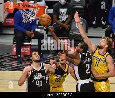 Los Angeles, United States. 18th Jan, 2021. Los Angeles Clippers' forward Kawhi Leonard scores past Indiana Pacers' forward Domantas Sabonis during the second quarter at Staples Center in Los Angeles on Sunday, January 17, 2021. The Clippers defeated the short-handed Pacers 129-96. Photo by Jim Ruymen/UPI Credit: UPI/Alamy Live News Stock Photo