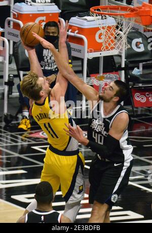 Los Angeles, United States. 18th Jan, 2021. Los Angeles Clippers' center Ivica Zuboc fouls Indiana Pacers' power forward Domantas Sabonis during the second quarter at Staples Center in Los Angeles on Sunday, January 17, 2021. The Clippers defeated the short-handed Pacers 129-96. Photo by Jim Ruymen/UPI Credit: UPI/Alamy Live News Stock Photo