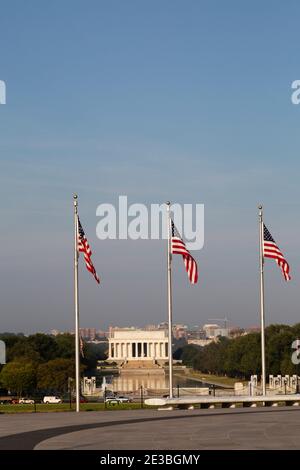 Stars and Stripes flags fly near the Lincoln Memorial in Washington DC, USA. The Lincoln Memorial Reflecting Pool stands in front of the national monu Stock Photo