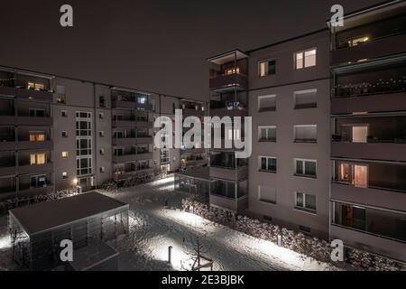 Courtyard at night in winter in a residential district in Munich, Germany Stock Photo