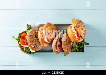 Assorted sandwiches in wooden box Stock Photo