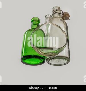 Empty old glass bottles, seen from beneath. Stock Photo