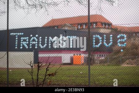 Hanover, Germany. 18th Jan, 2021. Unknown people used masks to write 'Are you dreaming?' on a fence at a children's playground. Credit: Julian Stratenschulte/dpa/Alamy Live News Stock Photo