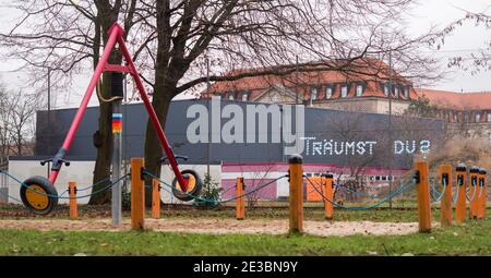 Hanover, Germany. 18th Jan, 2021. Unknown people used masks to write 'Are you dreaming?' on a fence at a children's playground. Credit: Julian Stratenschulte/dpa/Alamy Live News Stock Photo