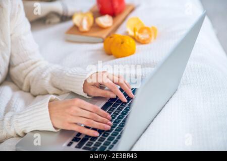 Close up picture of womans hands typing Stock Photo