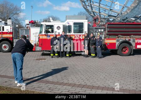 Firefighters and fire engine posing outside a fire station. Date: circa ...