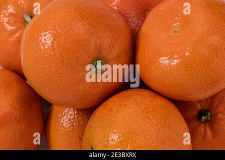 Tangerines  background texture. Lots of fresh tangerines. Fruit background. Stock Photo