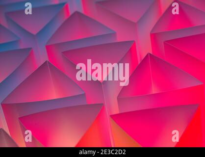Abstract background from handmade paper triangles and illuminated from below Stock Photo