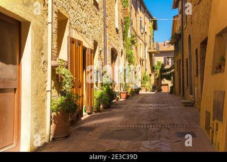 Historic stone buildings in a residential street in the old town of Pienza in Siena Province, Tuscany, Italy Stock Photo