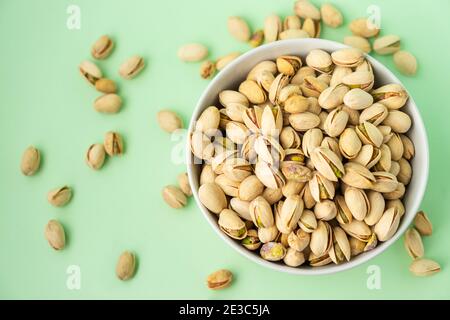 toasted pistachios in a bowl. Nuts vegan protein Stock Photo