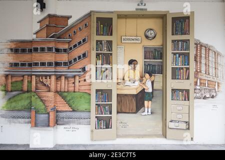 Colourful wall art murals by Singapore street artist Yip Yew Chong. Drawings are based on his childhood memories of his life and Singapore's culture. Stock Photo