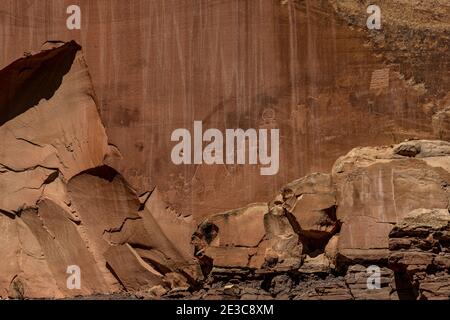 Line of Petroglyphs On Sandstone Wall in Capitol Reef National Park Stock Photo