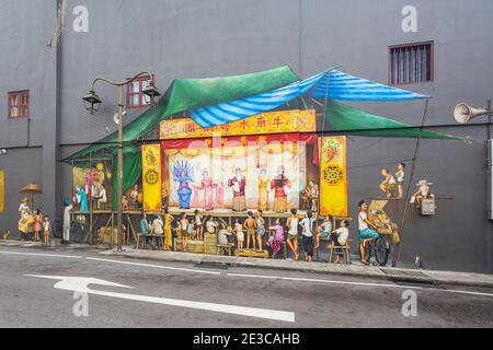 Colourful wall art murals by Singapore street artist Yip Yew Chong. Drawings are based on his childhood memories of his life and culture. Stock Photo