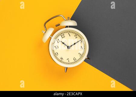 Alarm clock photo, flat lay with trendy 2021 year colors Stock Photo