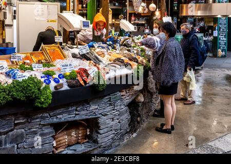 Young Asian Women Buying Seafood At Borough Market, London, UK. Stock Photo