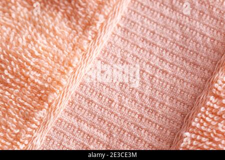 Soft peach-colored fleecy fabric. Orange fabric background Stock Photo