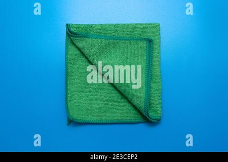 One Green microfiber cloth for different surfaces cleaning in kitchen, bathroom and other rooms. Stock Photo
