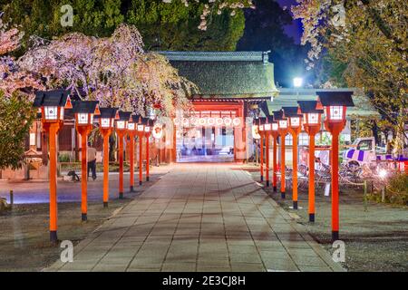 Kyoto, Japan entrance to Hirano Shrine at night during cherry blossom season. Stock Photo