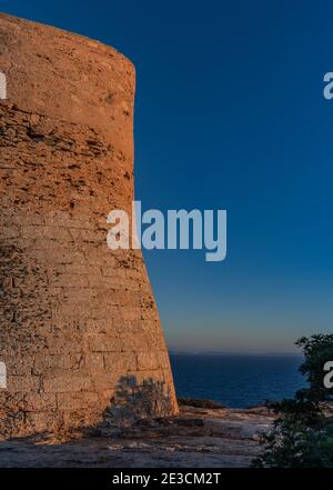 Image of the Cap Blanc watchtower in Mallorca with Cabrera in the background at sunset.This tower built in the s. XVI warned of pirate attacks. Stock Photo