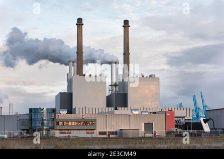 ROTTERDAM, THE NETHERLANDS - NOVEMBER 23, 2015: The Uniper coal power plant with smoking chimneys at the Maasvlakte near Rotterdam in the Netherlands. Stock Photo