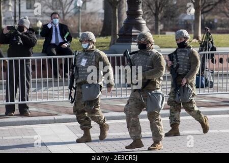 Washington, United States. 18th Jan, 2021. Members of the US National Guard arrive as the US Capitol goes into lockdown from a security breach during the dress rehearsal for the 59th inaugural ceremony for President-elect Joe Biden and Vice President-elect Kamala Harris at the U.S. Capitol on January 18, 2021 in Washington, DC. Biden will be sworn-in as the 46th president on January 20th. Pool Photo by Rod Lamkey/UPI Credit: UPI/Alamy Live News Stock Photo