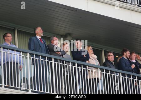 New Year race meeting at Ayr racecourse 2 Jan 2018. Crowds in the grandstand  cheer on the race Stock Photo