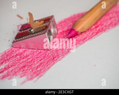 Pink colored pencil with sharpener Stock Photo