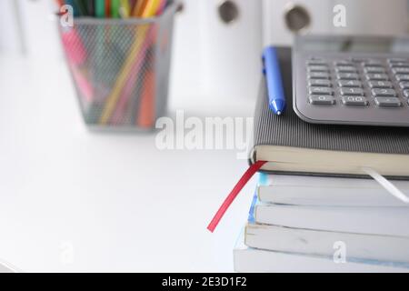 On table are documents diary with a calculator, pencils next to it Stock Photo