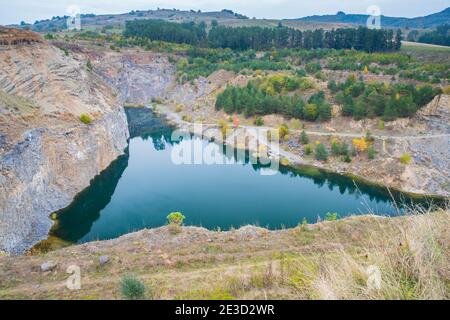 Up view of emerald lake in Racos is the result of volcanic activity who took place in Romanian Carpathians, happening 10,000 years ago. Stock Photo