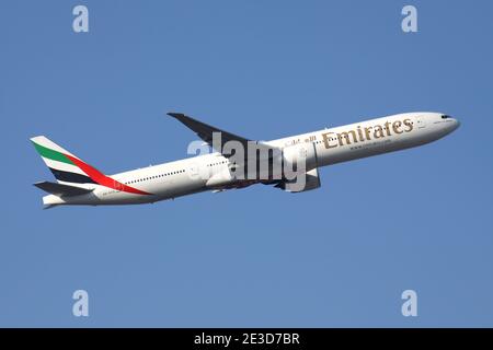 Emirates Boeing 777-300 with registration A6-ECQ airborne at Frankfurt Airport. Stock Photo
