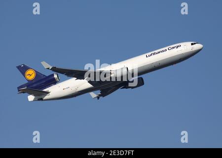 German Lufthansa Cargo McDonnell Douglas MD-11F with registration D-ALCN airborne at Frankfurt Airport. Stock Photo
