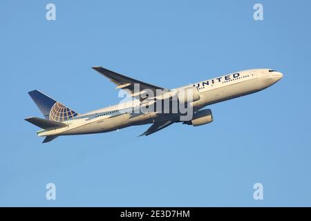 United Airlines Boeing 777-200 with registration N768UA airborne at Frankfurt Airport. Stock Photo