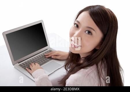 Portrait of young woman sitting in front of laptop,high view high quality photo Stock Photo