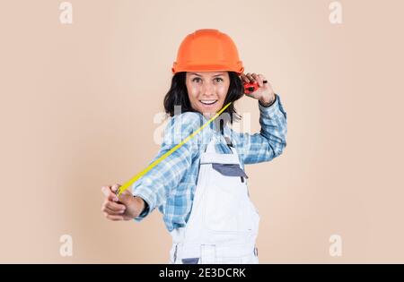 smiling female architect in safety hard hat, industry. Stock Photo