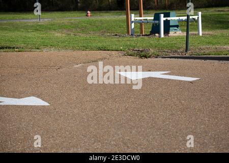 Pair of white arrows pointing in opposite directions Stock Photo