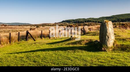 Ancient standing stones on moorland at Machrie Moor, with a mountain backdrop, on Scotland's Isle of Arran. Stock Photo