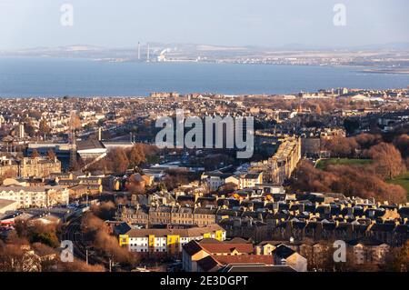 The East Coast Mainline railway winds through the eastern suburbs of Edinburgh, including Meadowbank and Craigentinny, with the Firth of Forth and Coc Stock Photo