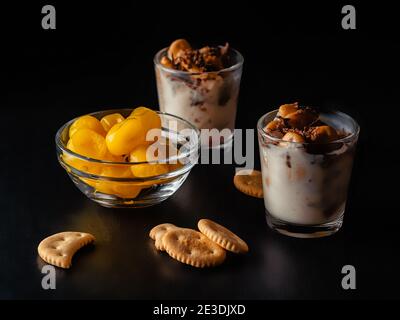 yogurt dessert with toppings on a dark background Stock Photo