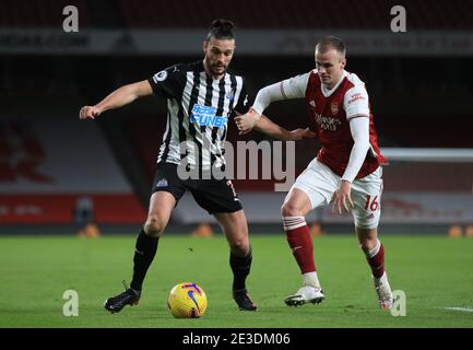 Newcastle United's Andy Carroll (left) and Arsenal's Rob Holding battle for the ball during the Premier League match at the Emirates Stadium, London. Picture date: Monday January 18, 2021. Stock Photo