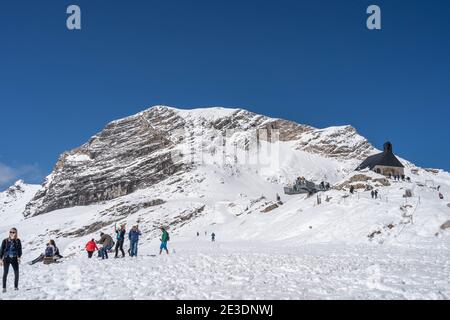 Zugspitze, Germany - Aug 5, 2020: Tourist at observation deck in snowy summer time Stock Photo