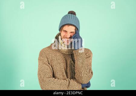 Stay warm. Frown man in casual fashion wear. Handsome guy with winter look. Young male style and fashion. Fashion trends for cold weather. Warm and cozy fashion accessories. Stock Photo