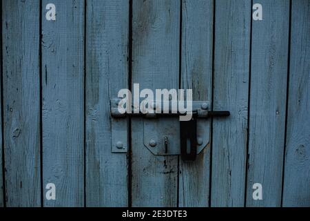 A wooden fence, a door. White boards Stock Photo