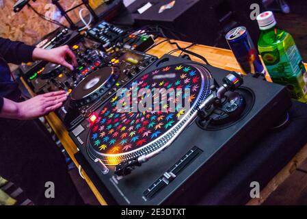 DJ at the remote control. Mixer remote at the concert. Musical equipment. Stock Photo