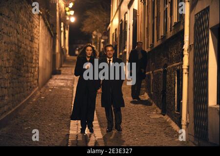 French President Nicolas Sarkozy and his wife Carla arrive prior to welcome British Prime Minister Gordon Brown and his wife Sarah for a private dinner at Carla Bruni Sarkozy's home in Paris, France on Januray 14, 2009. Photo by Jacques Witt/Pool/ABACAPRESS.COM Stock Photo