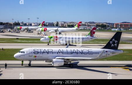TAP Air Portugal Airbus A320 Aircraft In The Livery Of Star Alliance With Other TAP Air Portugal In The Background At Lisbon Airport Portugal Stock Photo